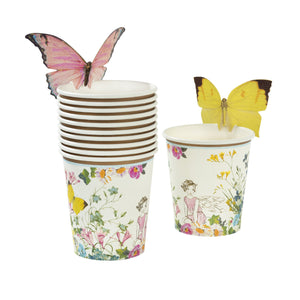 These paper cups are every little birthday fairy’s dream!   Featuring a beautiful floral fairy setting design, these cups come with sweet butterflies to attach to the top of your cups, adding that extra touch of magic. A brilliant addition to your table if you’re in search of fairy styled party ideas.   These cups look great with our Truly Fairy paper plates and napkins, to create a magical fairytale setting. Each pack contains 12 paper cups with butterflies in 2 different designs. 