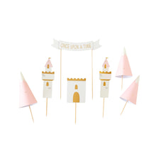 Create a cake fit for a fairy tale with this magical cake topper set! Included are castle pieces, mountains and a "Once Upon a Time" banner that will make any cake a the perfect addition to any princess party.  • 7 individual decorative cake toppers • 6" - 9" tall toppers • gold foil accents
