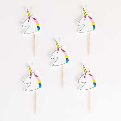 5 candles in the shape of a unicorn drawing by My Little Day.  These candles are perfect for a birthday party with the theme 